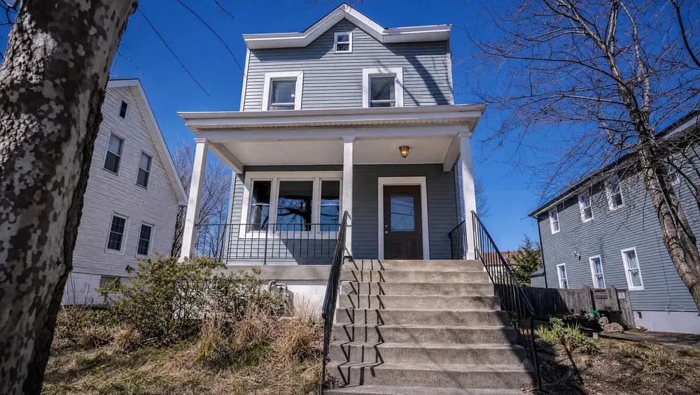 Cash home buyer reviewing a property walkthrough in Atlantic County NJ shore community.