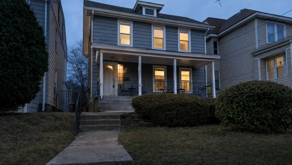 A condemned NJ house with a violation notice on the door, illustrating code violations & condemned homes in New Jersey