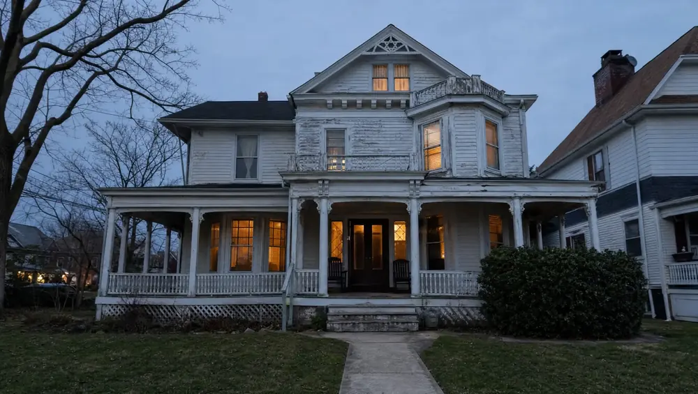 Cash home buyer meeting a Washington Township NJ seller outside a ranch-style house ready for a fast as-is sale